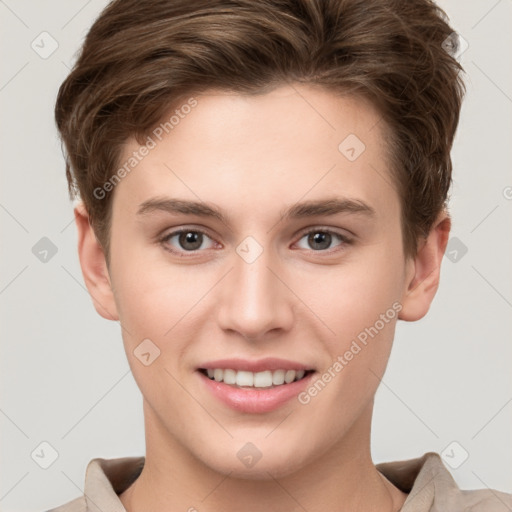 Joyful white young-adult female with short  brown hair and grey eyes