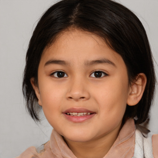 Joyful white child female with medium  brown hair and brown eyes