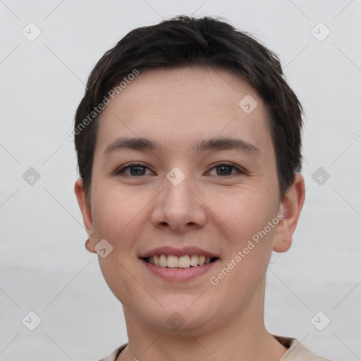 Joyful white young-adult female with short  brown hair and brown eyes