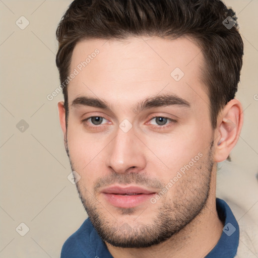 Neutral white young-adult male with short  brown hair and brown eyes