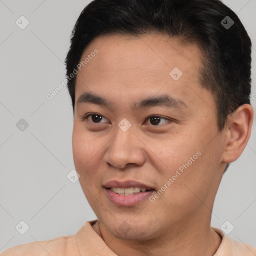 Joyful asian young-adult male with short  brown hair and brown eyes