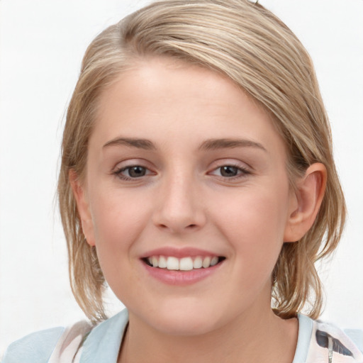 Joyful white young-adult female with medium  brown hair and blue eyes