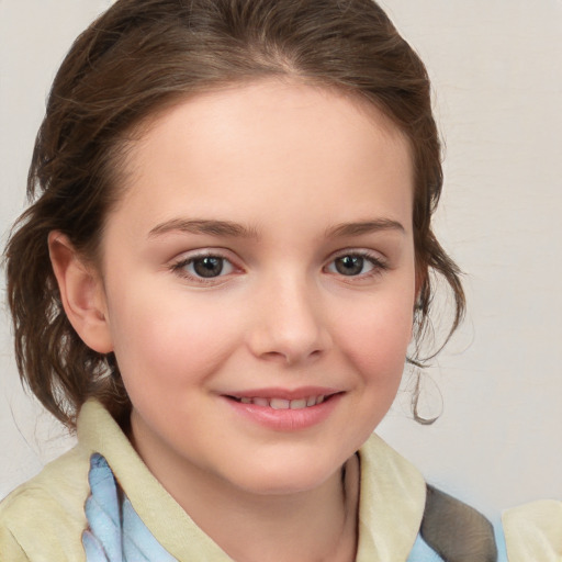 Joyful white child female with medium  brown hair and brown eyes