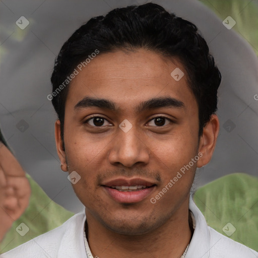 Joyful latino young-adult male with short  black hair and brown eyes