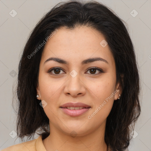 Joyful latino young-adult female with medium  brown hair and brown eyes