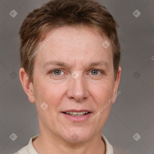 Joyful white adult male with short  brown hair and grey eyes