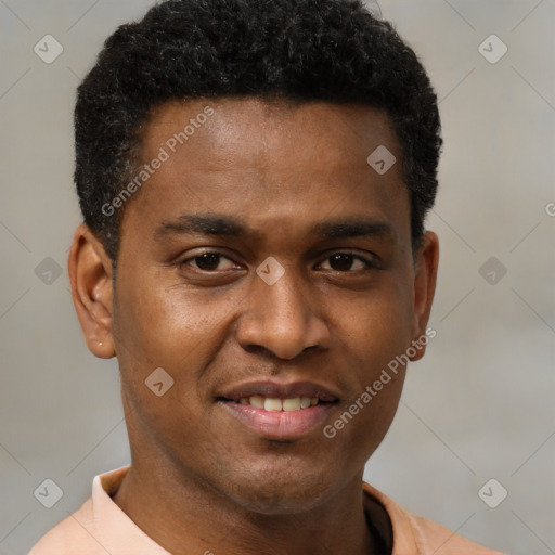 Joyful black young-adult male with short  brown hair and brown eyes