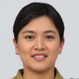 Joyful asian young-adult female with short  brown hair and brown eyes