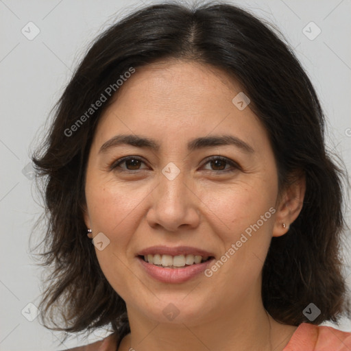 Joyful white adult female with medium  brown hair and brown eyes