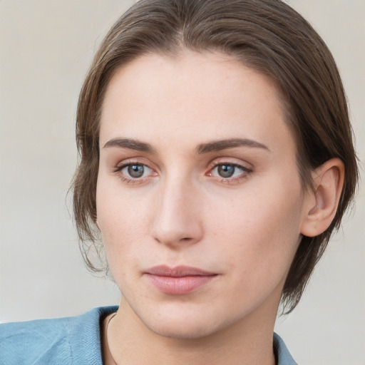 Neutral white young-adult female with medium  brown hair and grey eyes