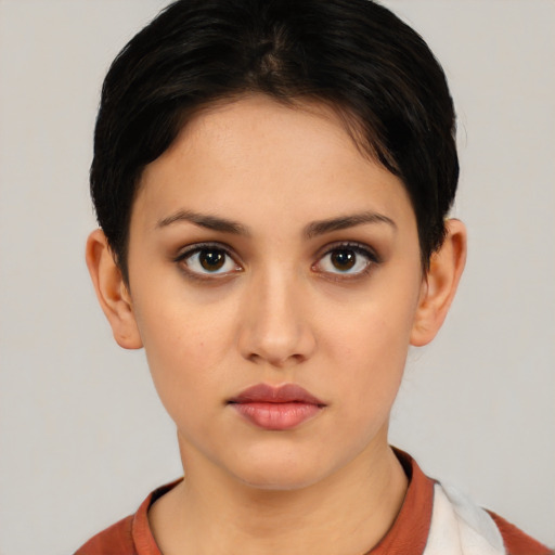 Neutral white young-adult female with short  black hair and brown eyes