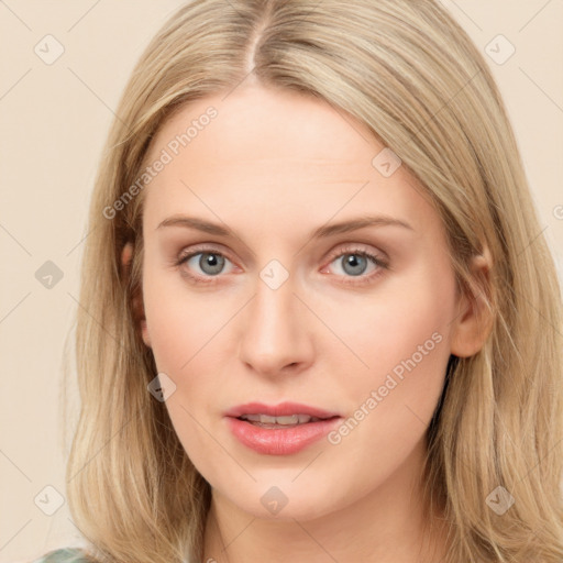 Joyful white young-adult female with long  brown hair and blue eyes