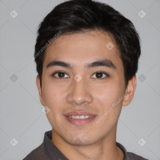 Joyful white young-adult male with short  black hair and brown eyes