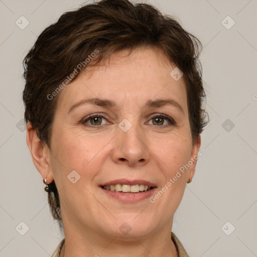 Joyful white adult female with short  brown hair and grey eyes