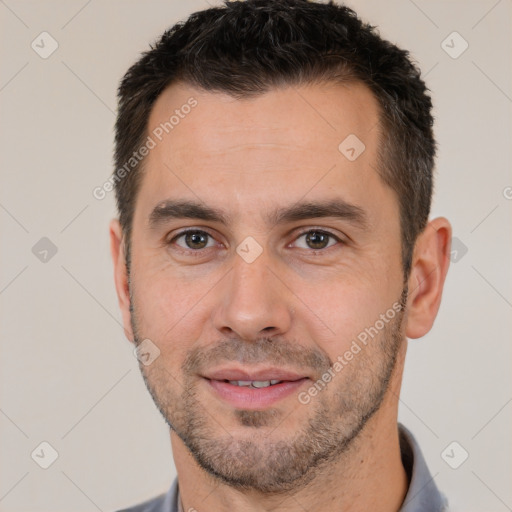 Joyful white young-adult male with short  brown hair and brown eyes