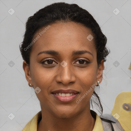 Joyful black young-adult female with short  black hair and brown eyes