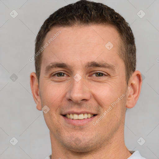 Joyful white adult male with short  brown hair and brown eyes