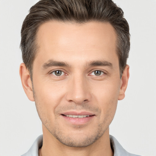 Joyful white young-adult male with short  brown hair and brown eyes