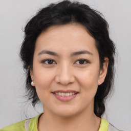 Joyful asian young-adult female with short  brown hair and brown eyes