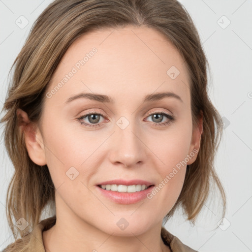 Joyful white young-adult female with medium  brown hair and blue eyes