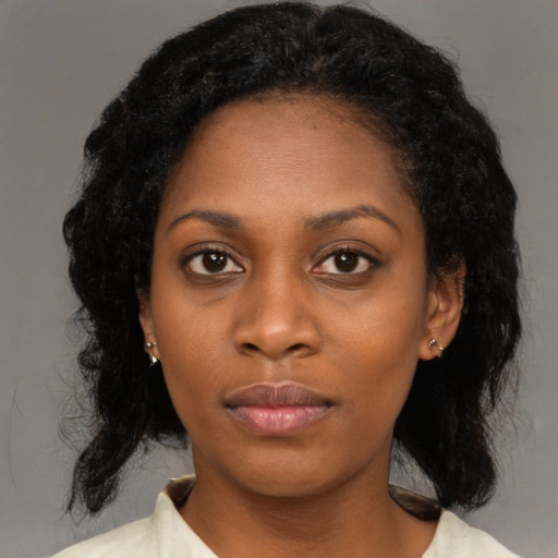 Neutral black young-adult female with medium  black hair and brown eyes