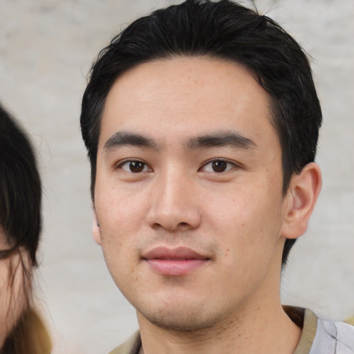 Neutral asian young-adult male with short  black hair and brown eyes
