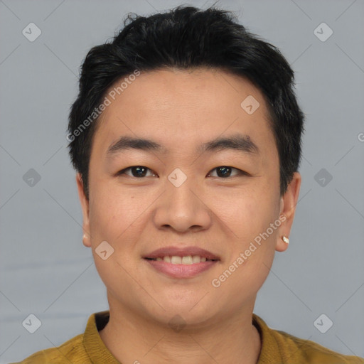 Joyful asian young-adult male with short  black hair and brown eyes