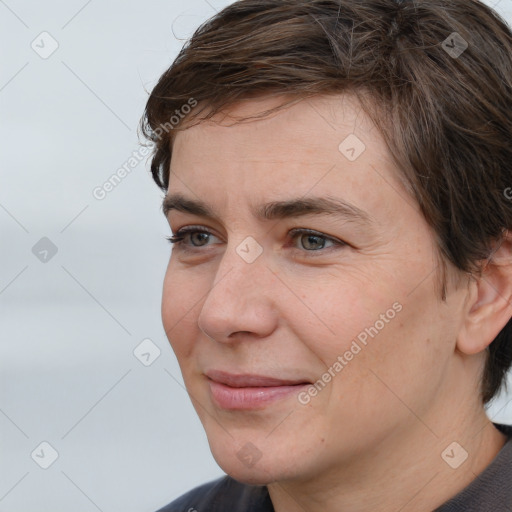 Joyful white young-adult male with medium  brown hair and brown eyes