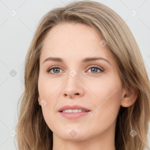 Joyful white young-adult female with long  brown hair and blue eyes