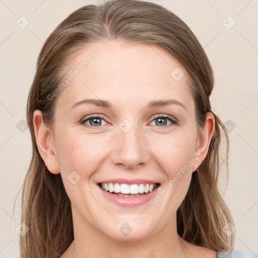 Joyful white young-adult female with medium  brown hair and grey eyes