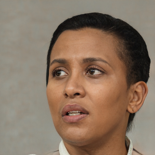 Neutral black adult female with short  black hair and brown eyes