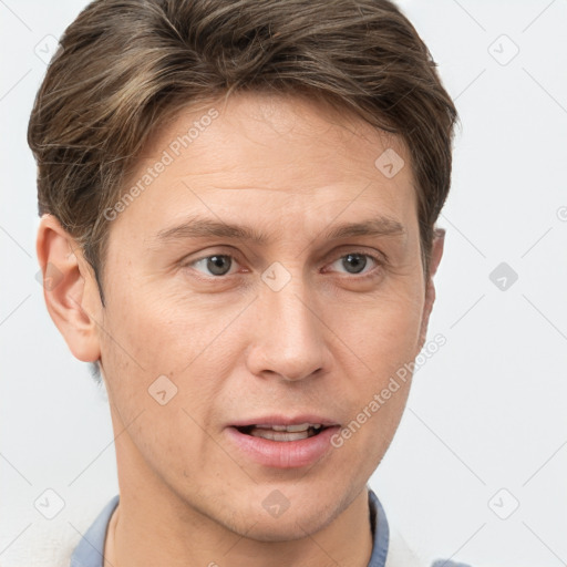 Joyful white adult male with short  brown hair and grey eyes