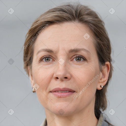 Joyful white adult female with medium  brown hair and grey eyes