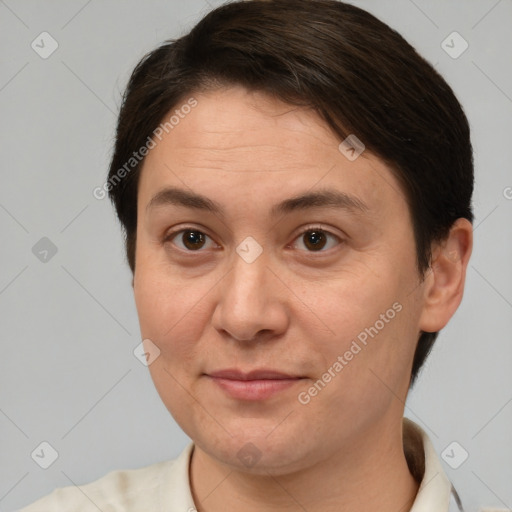 Joyful white adult female with short  brown hair and brown eyes