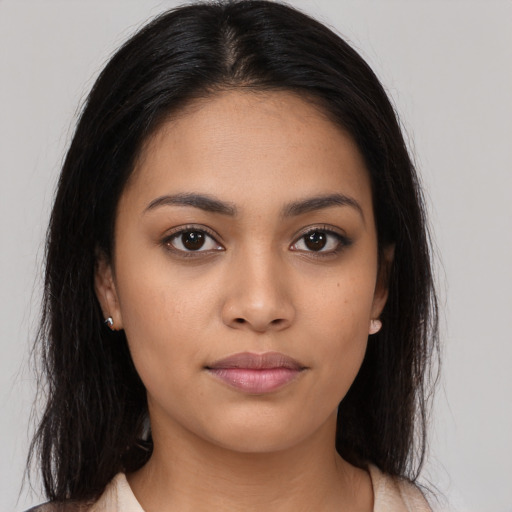 Neutral latino young-adult female with long  brown hair and brown eyes