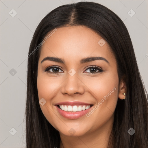 Joyful white young-adult female with long  black hair and brown eyes