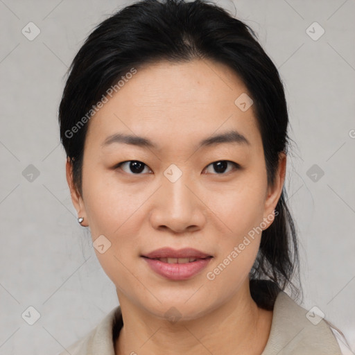 Joyful asian young-adult female with medium  black hair and brown eyes