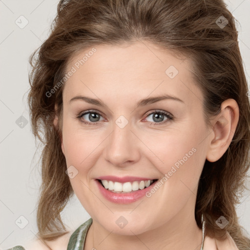 Joyful white young-adult female with medium  brown hair and green eyes