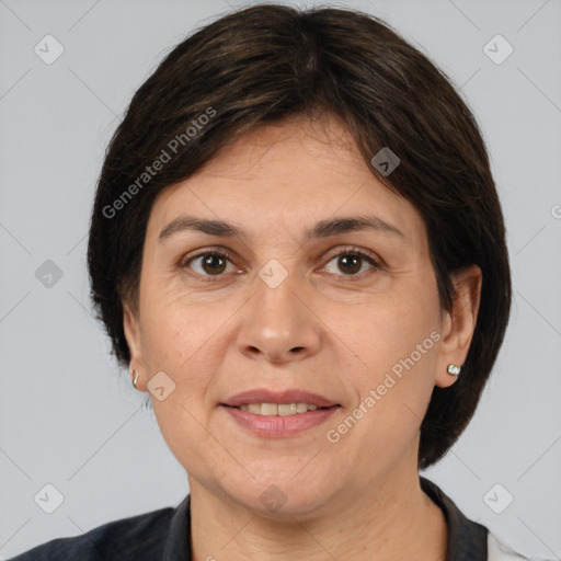 Joyful white adult female with medium  brown hair and brown eyes