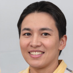 Joyful white young-adult female with short  black hair and brown eyes