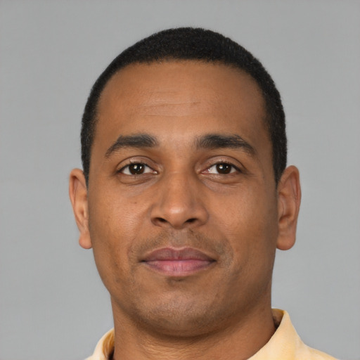 Neutral latino young-adult male with short  brown hair and brown eyes