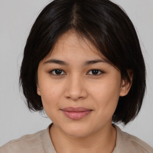 Joyful white young-adult female with medium  brown hair and brown eyes