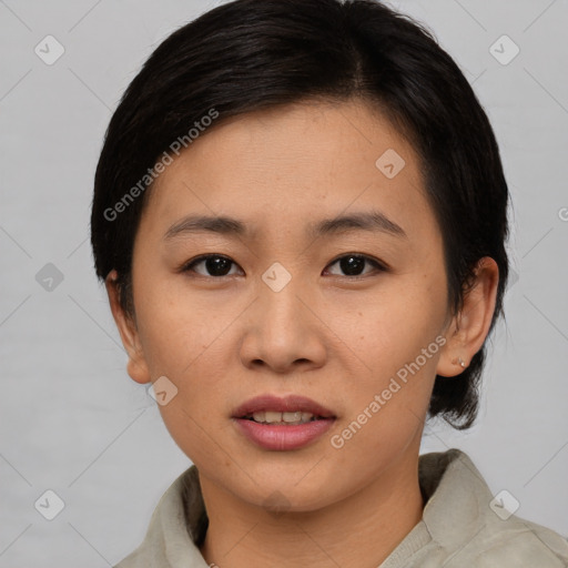 Joyful asian young-adult female with medium  black hair and brown eyes