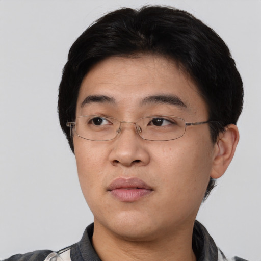 Neutral asian young-adult male with short  black hair and brown eyes