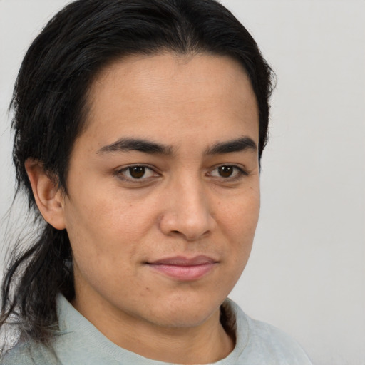 Joyful latino young-adult male with medium  brown hair and brown eyes