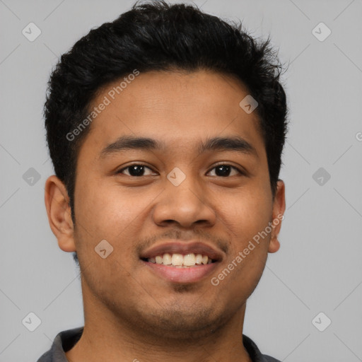 Joyful latino young-adult male with short  black hair and brown eyes