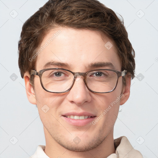 Joyful white adult male with short  brown hair and grey eyes