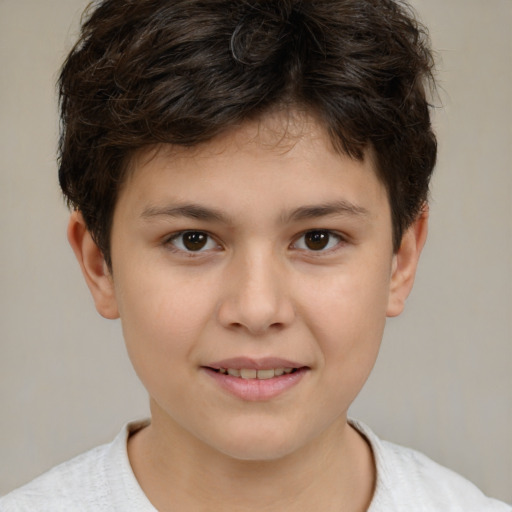Joyful white child male with short  brown hair and brown eyes