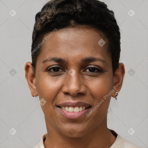 Joyful black young-adult female with short  black hair and brown eyes