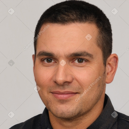 Joyful white young-adult male with short  brown hair and brown eyes